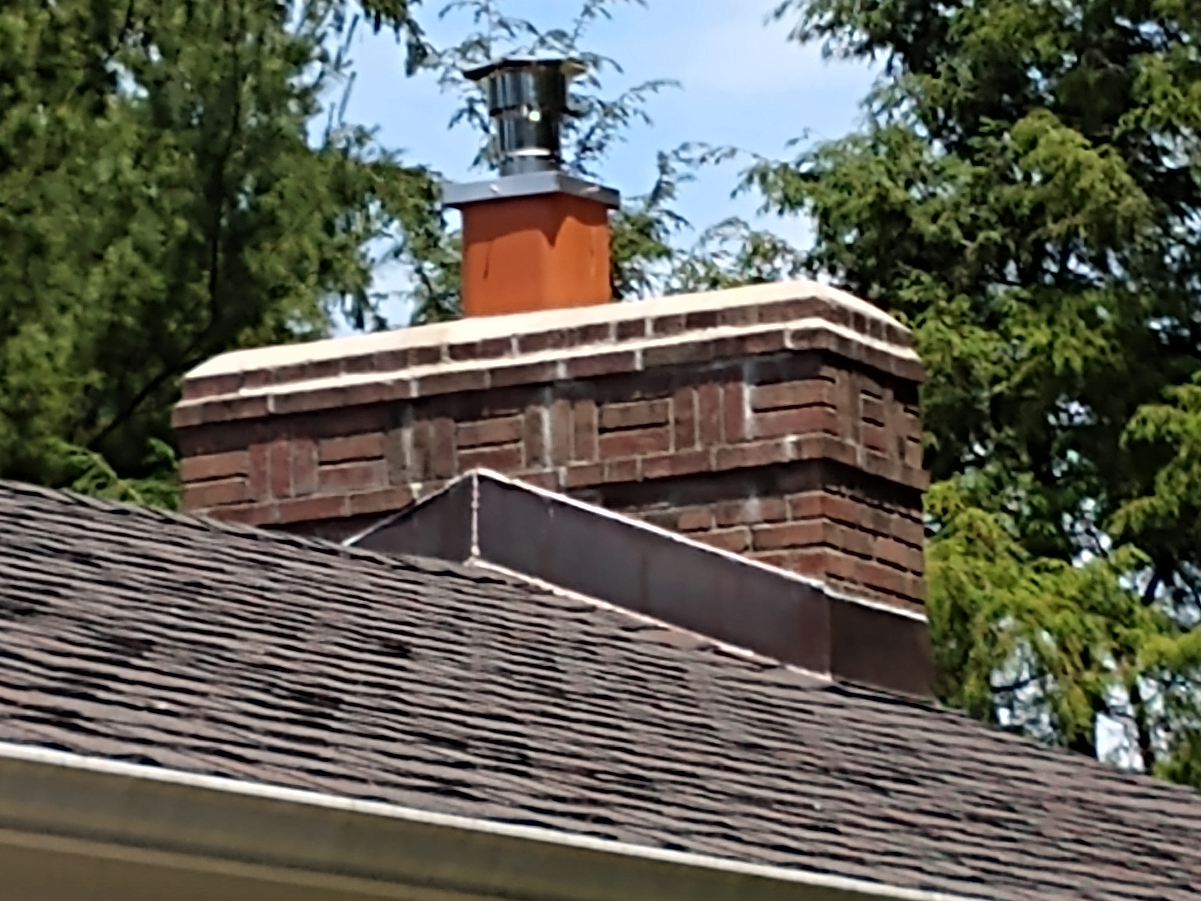 Stainless steel chimney cap with animal guard in Lindenhurst, New York